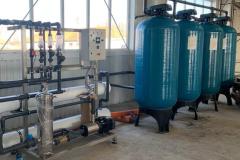 Water treatment system with multimedia filter, water softener, activated carbon and reverse osmosis for a milk processor