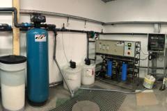 Water treatment system with water softener, activated carbon and reverse osmosis for a tube manufacturer
